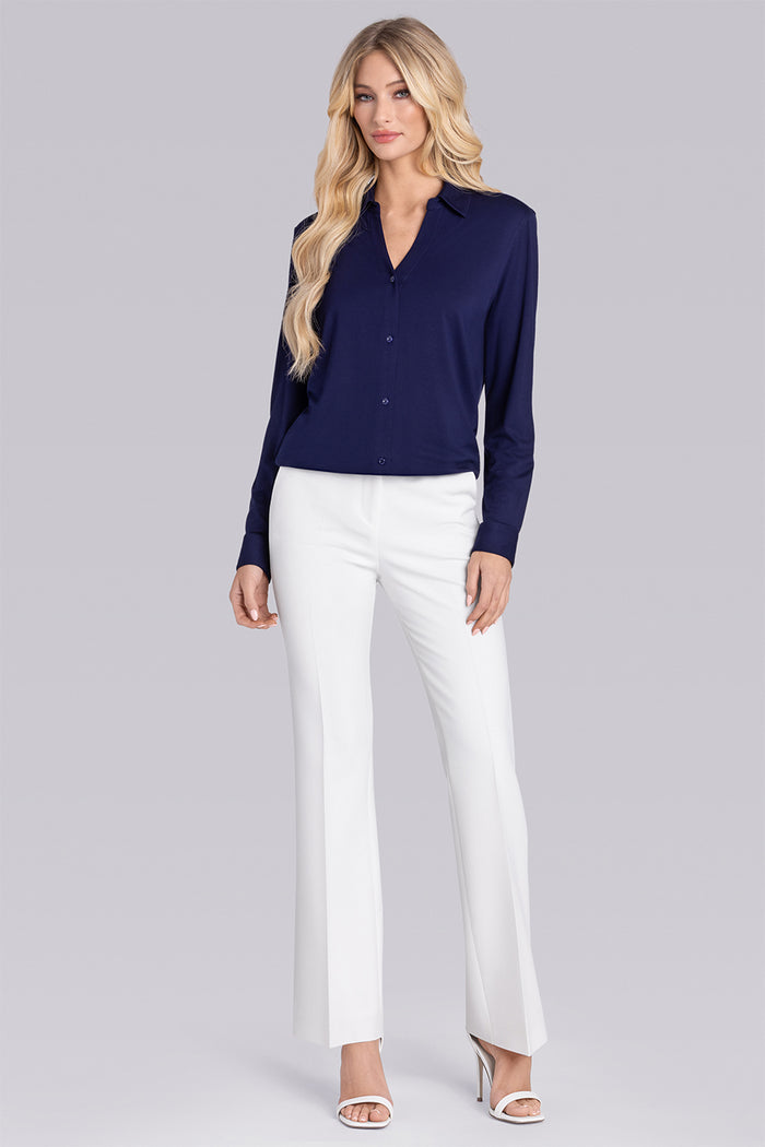 Model wearing Prestige Deep Sea Blue long sleeve Icy Bamboo® v-neck shirt, styled with white pants
