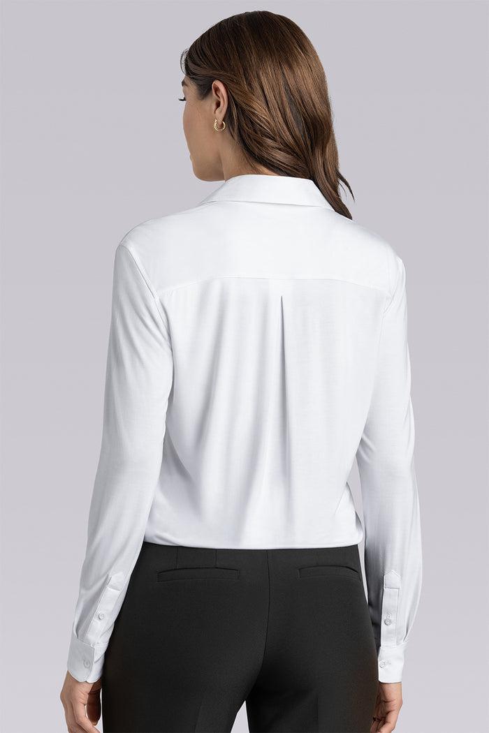 Model wearing Prestige White long sleeve Icy Bamboo® v-neck shirt, styled with black pants