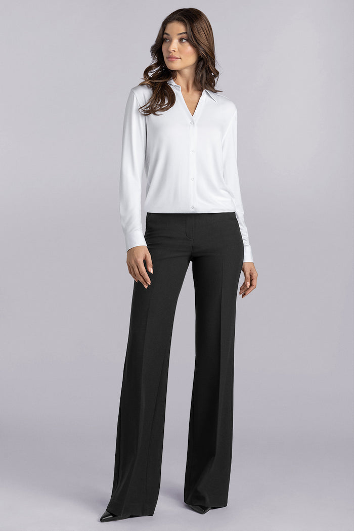 Model wearing Prestige White long sleeve Icy Bamboo® v-neck shirt, styled with black pants