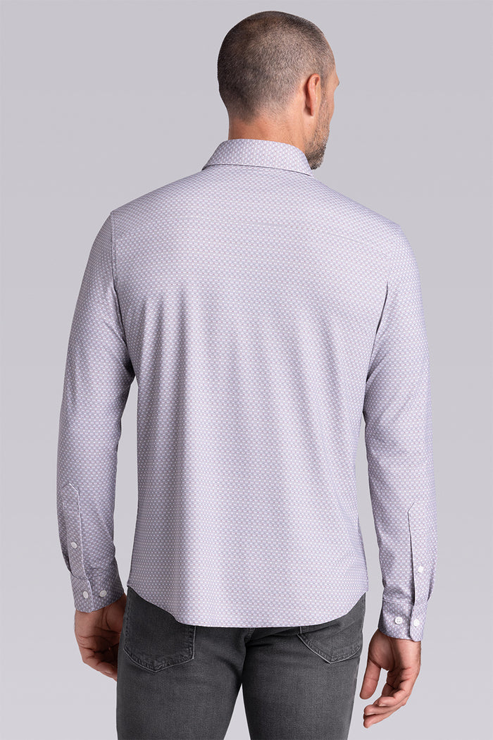 Model wearing Prism Chateau Grey 6-Way Knit® long sleeve classic collar shirt, styled with grey jeans