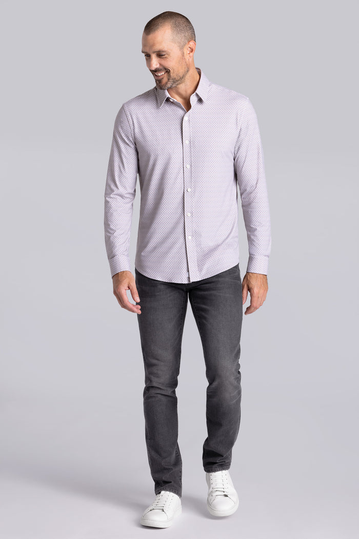 Model wearing Prism Chateau Grey 6-Way Knit® long sleeve classic collar shirt, styled with grey jeans