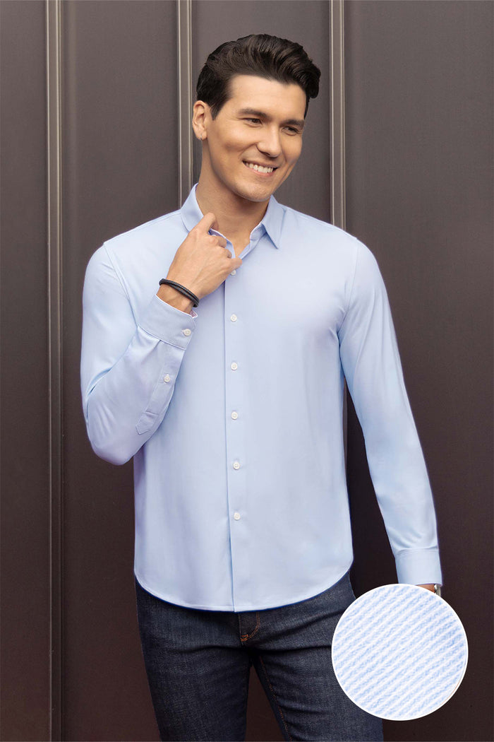Model wearing Prism Seafoam 6-Way Knit® long sleeve classic collar shirt, styled with jeans