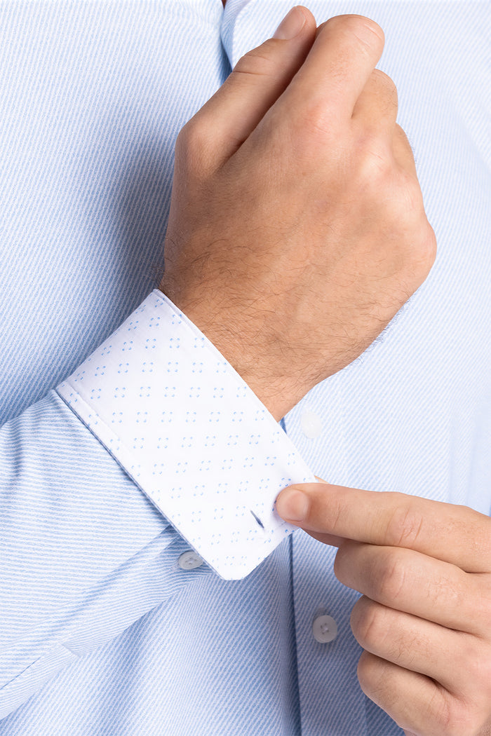 Model wearing Prism Seafoam 6-Way Knit® long sleeve classic collar shirt, styled with jeans