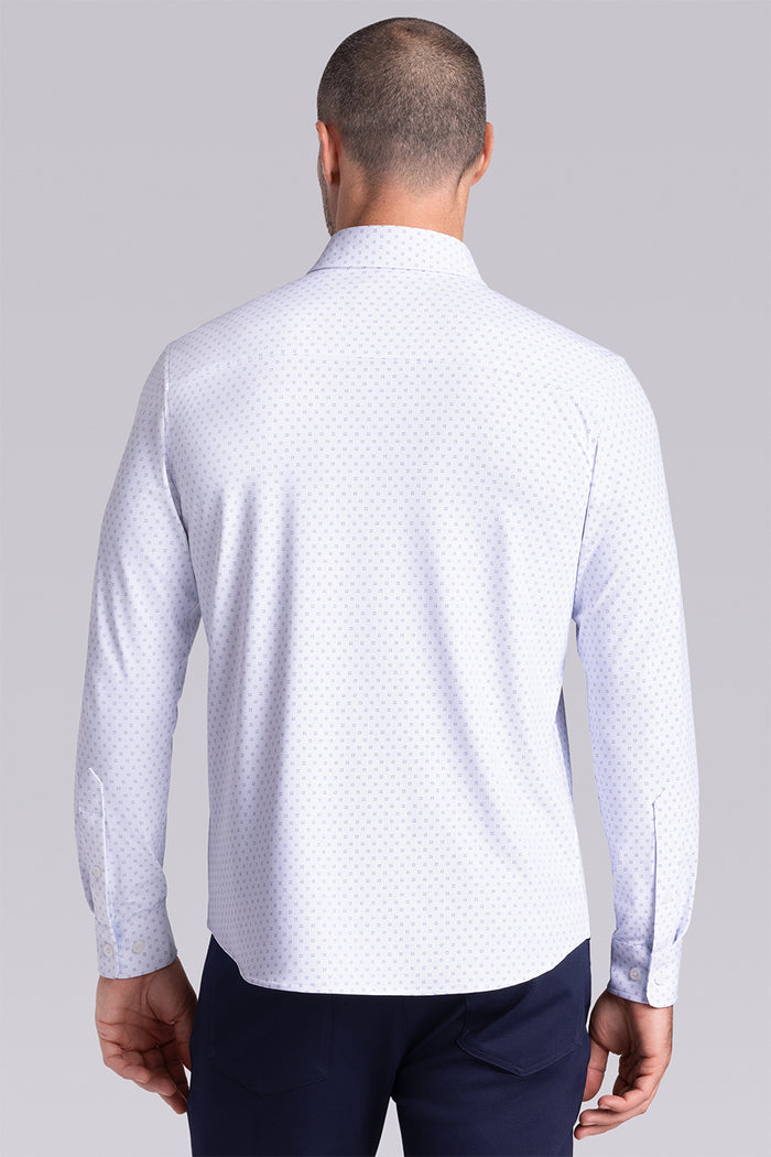 Model wearing Prism White 6-Way Knit® long sleeve classic collar shirt, styled with black pants