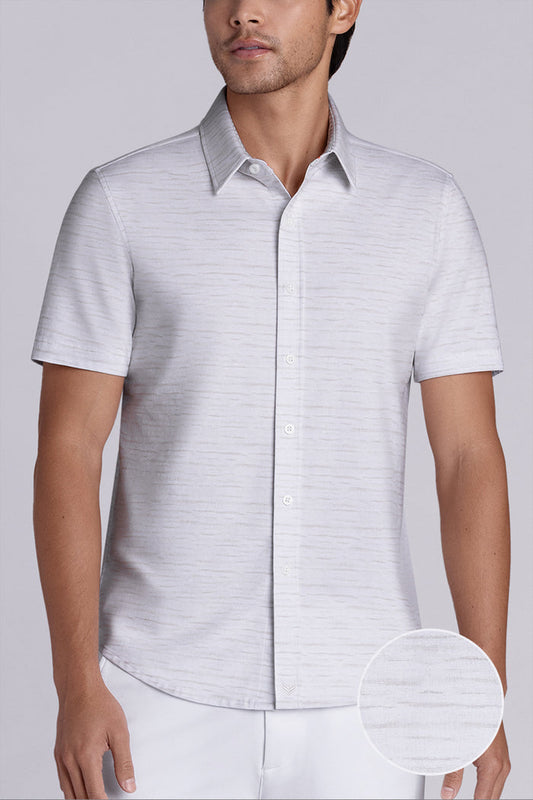Model wearing Radar Beige short sleeve casual shirt with collar, styled with navy pants.