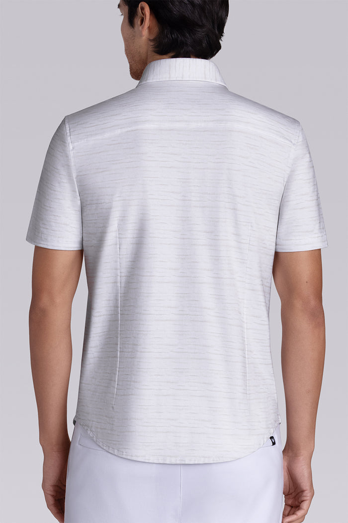 Model wearing Radar Beige short sleeve casual shirt with collar, styled with navy pants.