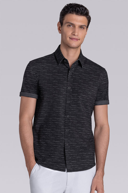 Model wearing Radar Black short sleeve casual shirt with collar, styled with navy pants.