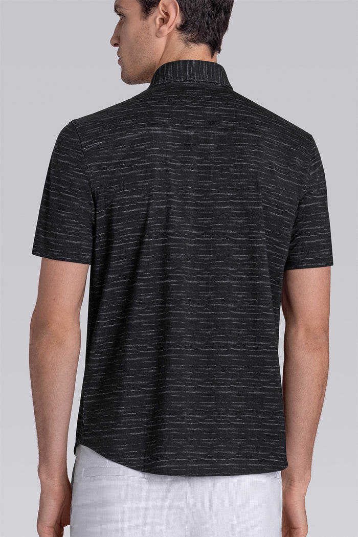 Model wearing Radar Black short sleeve casual shirt with collar, styled with navy pants.