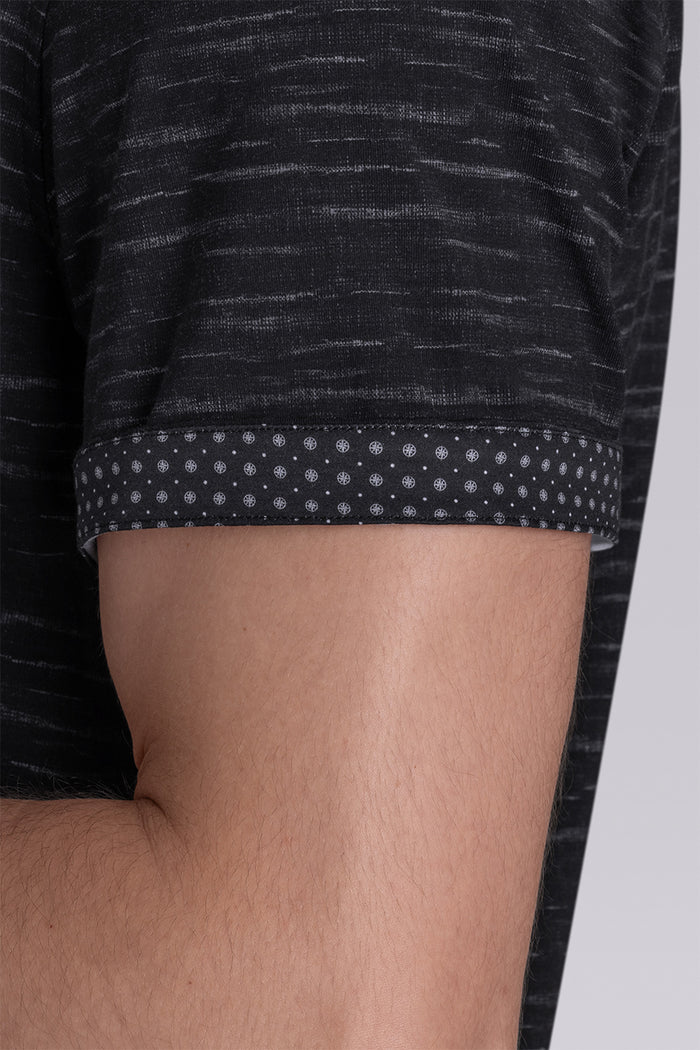 Model wearing Radar Black short sleeve casual shirt with collar, styled with navy pants.