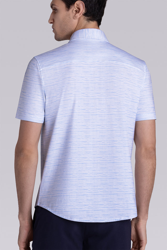 Model wearing Radar Light Blue short sleeve casual shirt with collar, styled with navy pants.