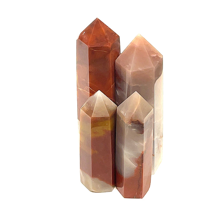 A collection of Red Jasper gemstone towers of varying sizes, arranged vertically, displaying their polished, rectangular faceted shapes and translucent red coloring on a white background front view.
