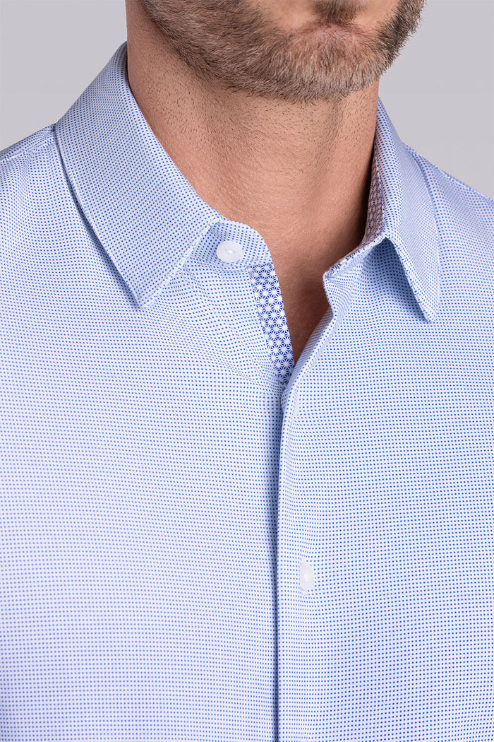 Model wearing Renowned Light Blue Icy Cotton® long sleeve casual shirt with collar placket, styled with navy pants