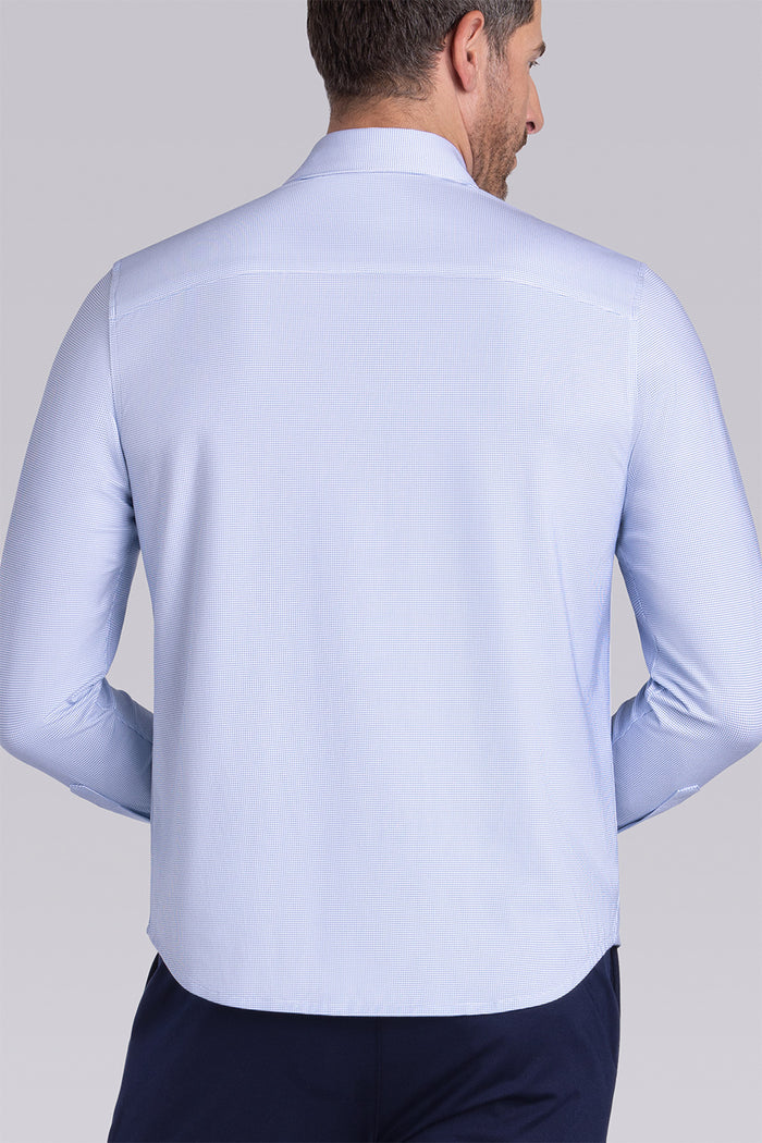 Model wearing Renowned Light Blue Icy Cotton® long sleeve casual shirt with collar placket, styled with navy pants