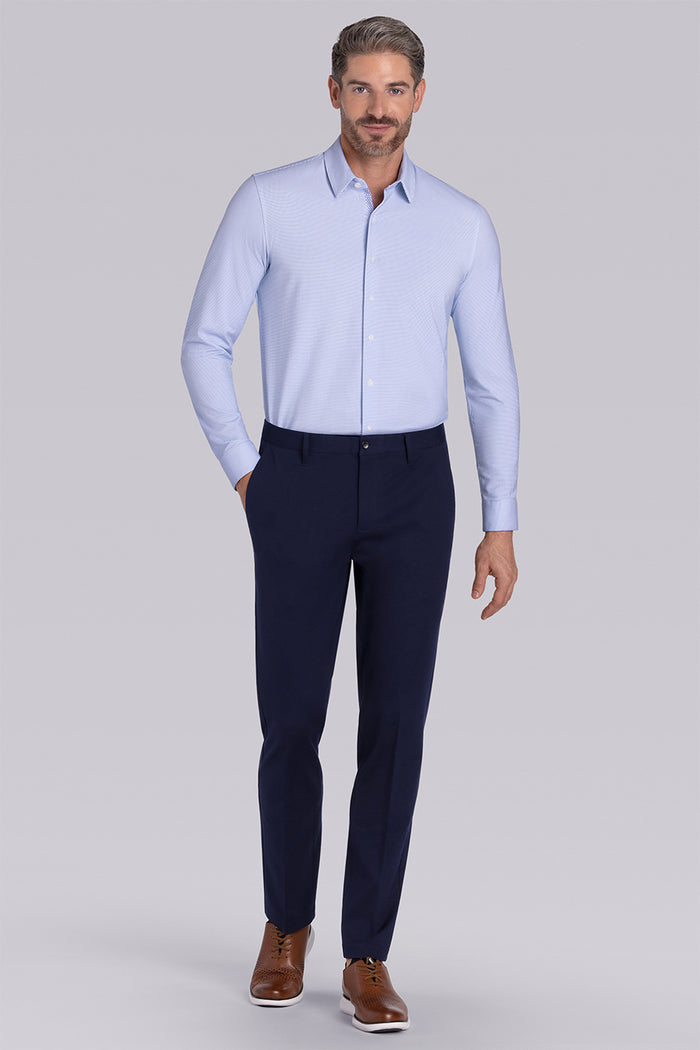 Model wearing Renowned Light Blue Icy Cotton® long sleeve casual shirt with collar placket, styled with navy pants