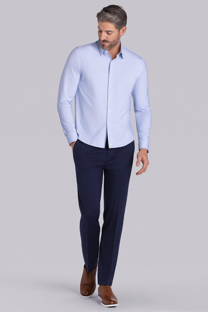 Model wearing Renowned Light Blue Icy Cotton® long sleeve casual shirt with collar placket, styled with navy pants