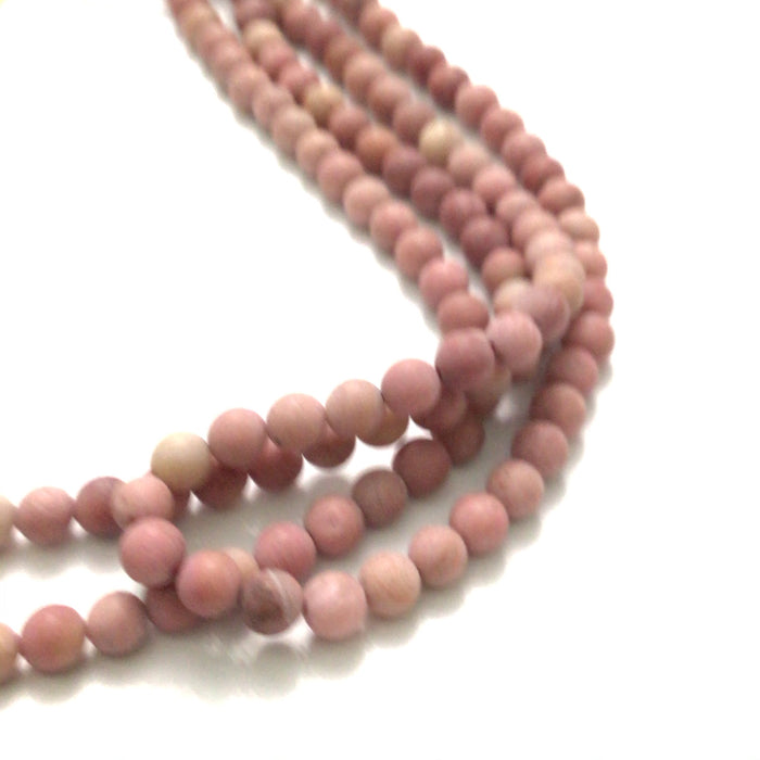 6mm Rhodonite smooth round matte gemstone strands, front overview.