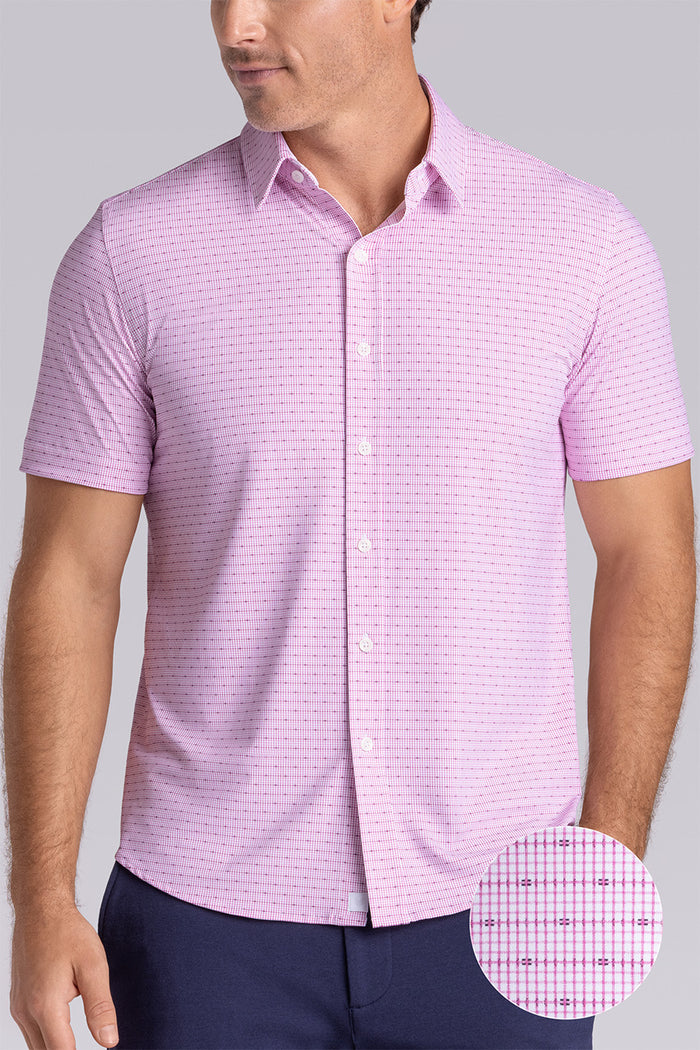 Model wearing Rhythm Raspberry Sorbet 6-Way Knit® short sleeve casual shirt with collar placket, styled with navy shorts.
