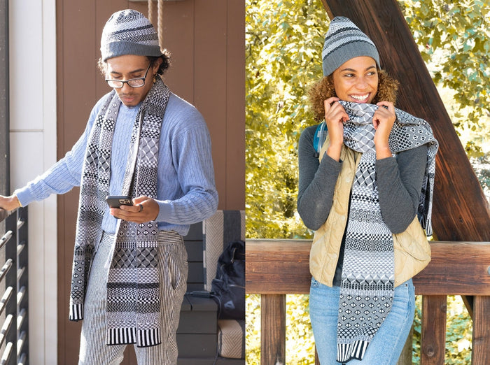 Adults wearing patterned knit scarf and beanie outdoors in autumn