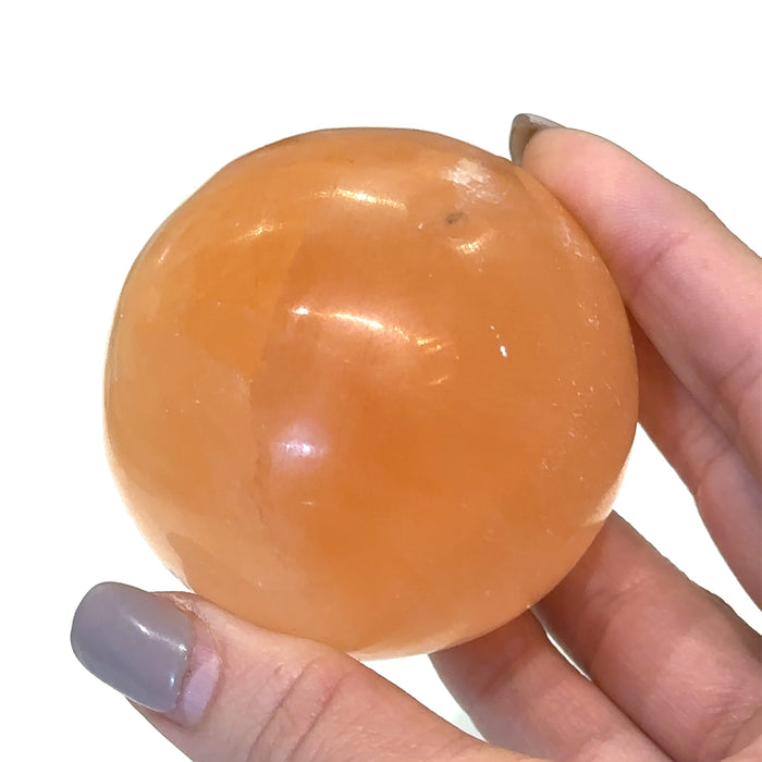 One (2.34'' 245g) Orange Selenite Sphere