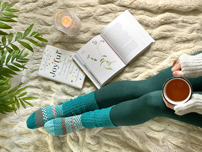Fusion Abalone Socks in a cosy reading and relaxation setting
