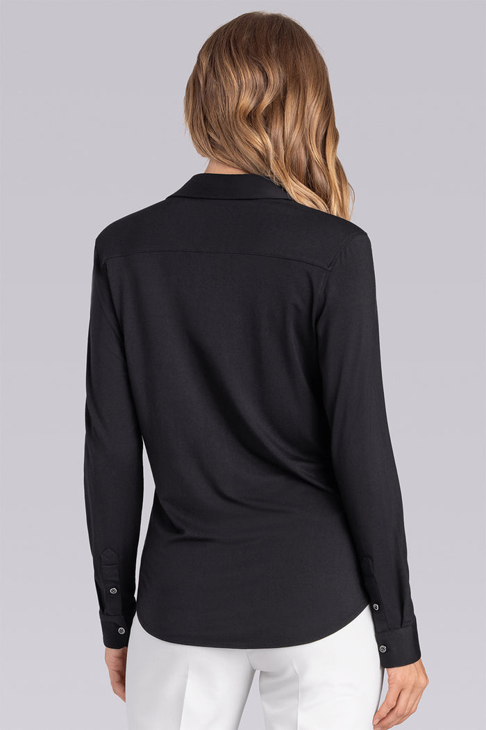 Model wearing Sophistication Black Icy Bamboo® long sleeve button shirt, styled with white pants