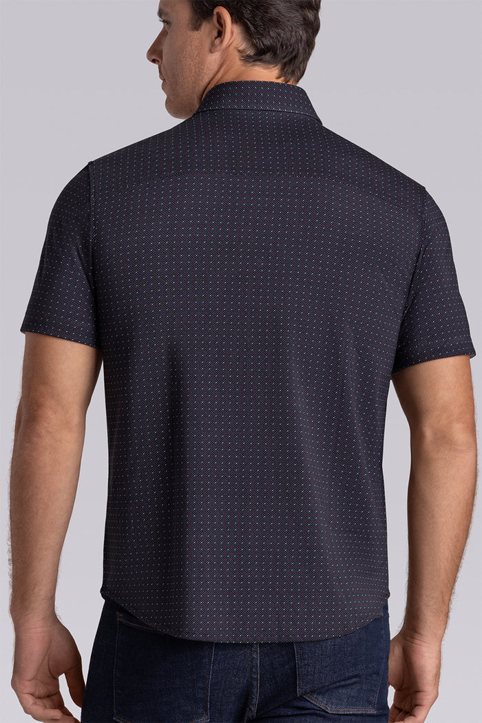 Model wearing Spark Black Icy Cotton® short sleeve classic collar shirt, styled with black pants