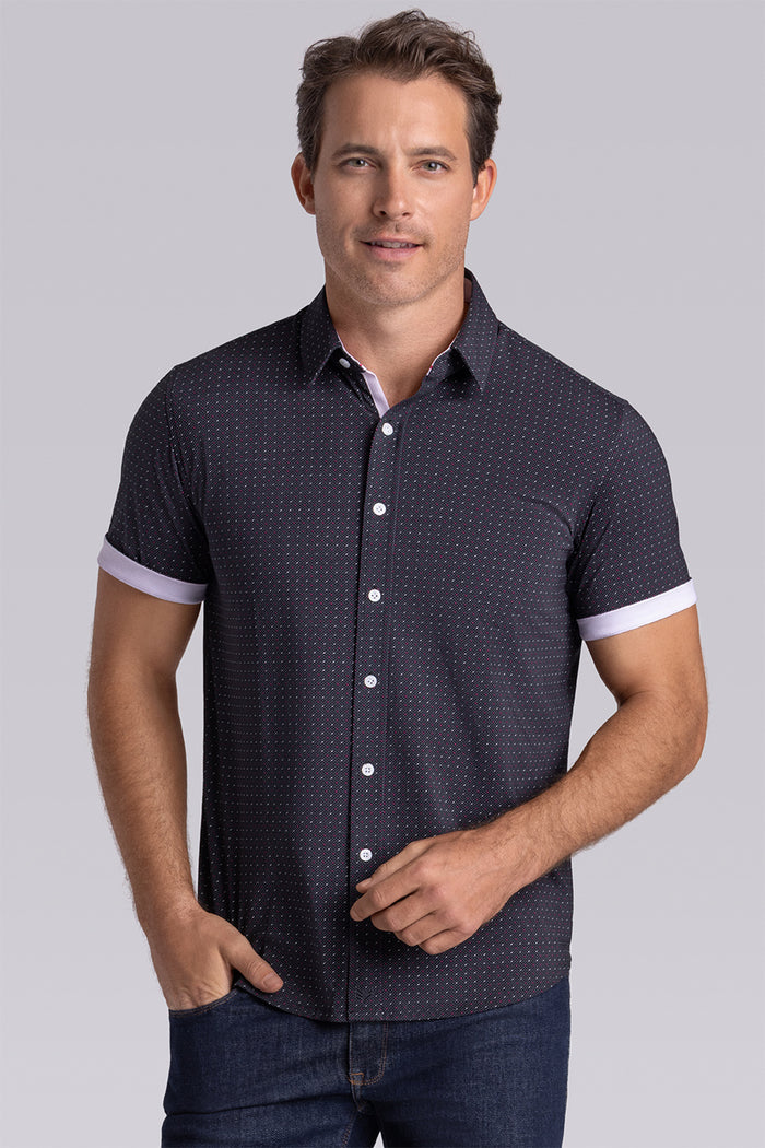 Model wearing Spark Black Icy Cotton® short sleeve classic collar shirt, styled with black pants