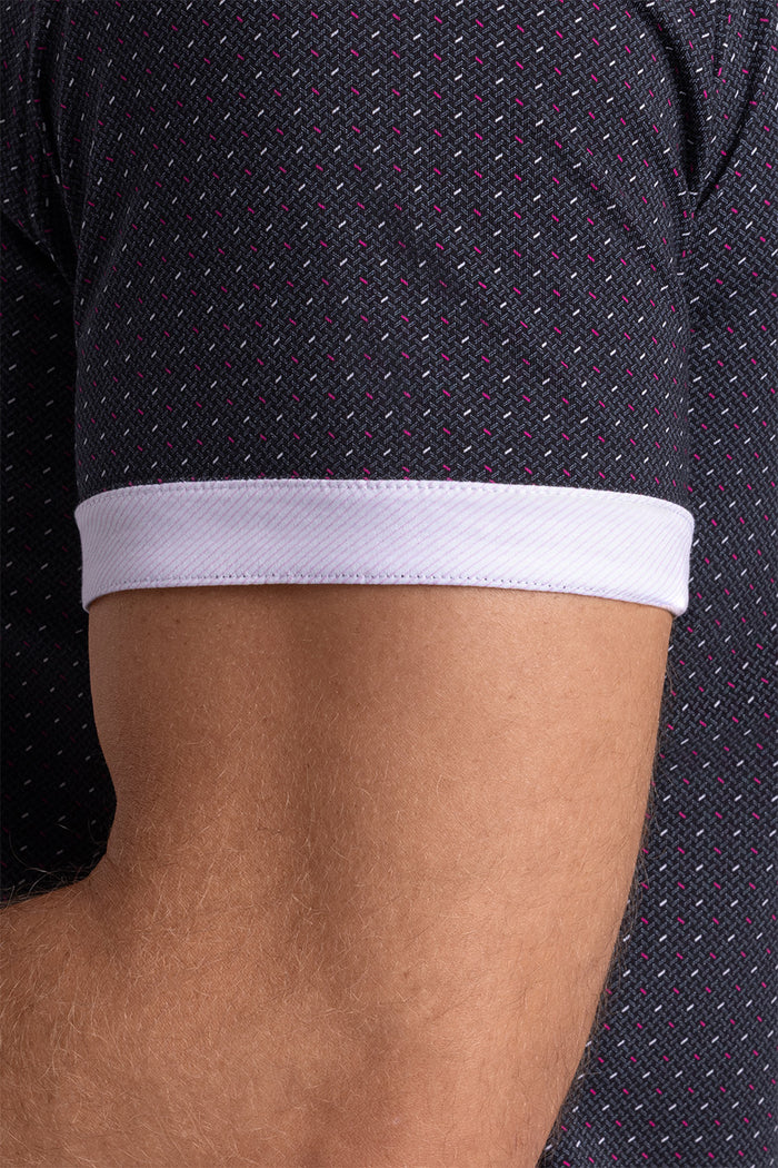 Model wearing Spark Black Icy Cotton® short sleeve classic collar shirt, styled with black pants
