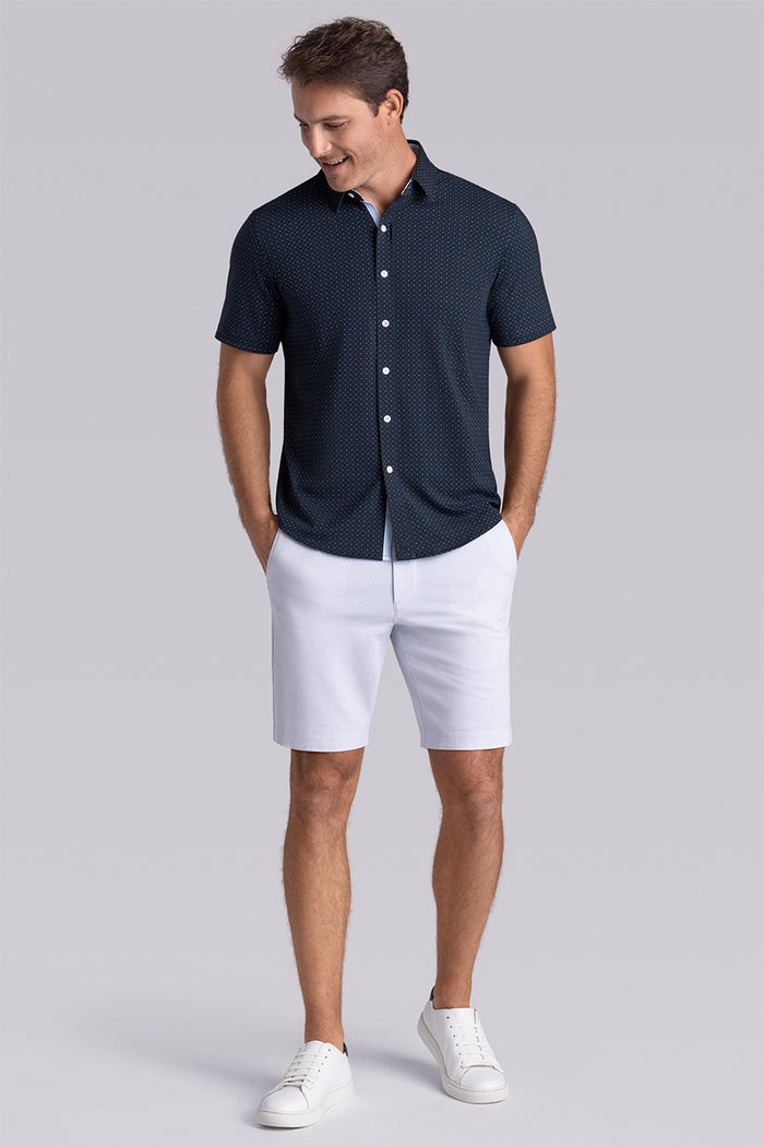 Model wearing Spark Monaco Blue Icy Cotton® short sleeve classic collar shirt, styled with white shorts