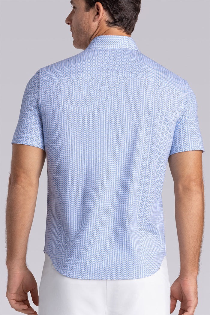 Model wearing Spectrum Light Blue Icy Cotton® short sleeve classic collar shirt, styled with white shorts
