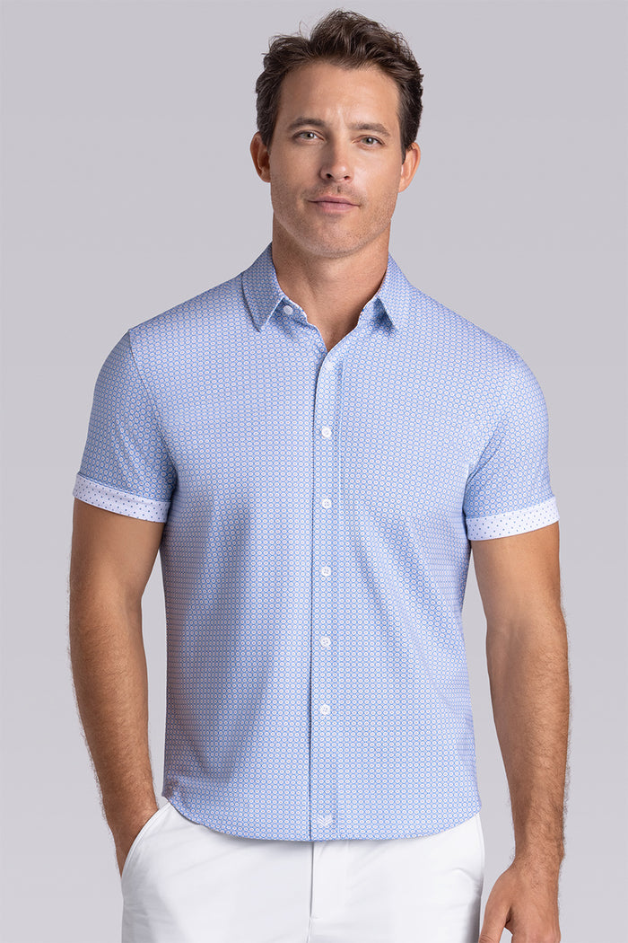 Model wearing Spectrum Light Blue Icy Cotton® short sleeve classic collar shirt, styled with white shorts