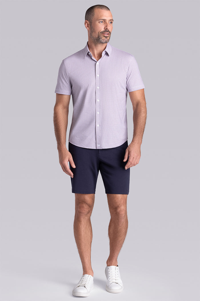 Model wearing Spectrum White Plum Icy Cotton® short sleeve classic collar shirt, styled with navy shorts