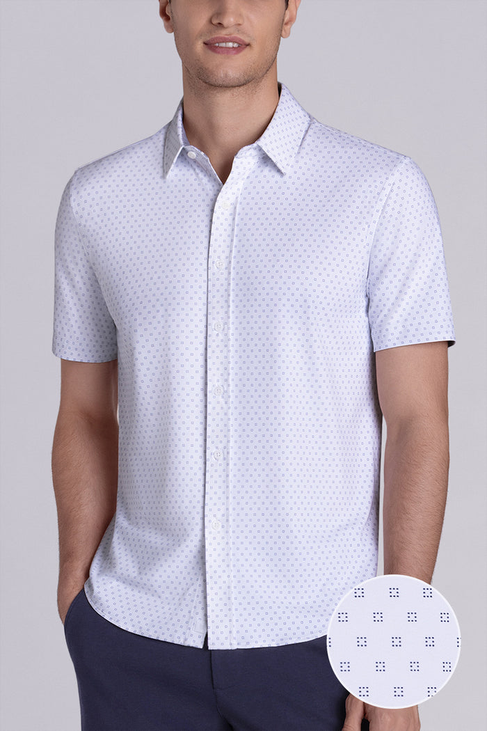 Model wearing Spirited White short sleeve classic collar shirt, styled with navy shorts