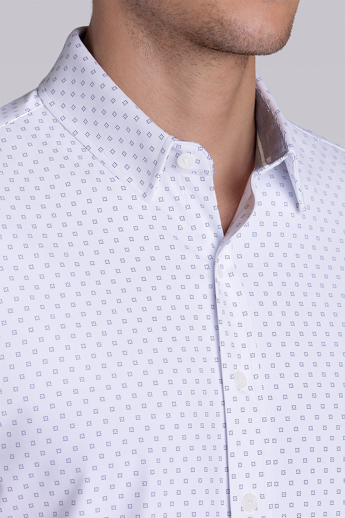 Model wearing Spirited White short sleeve classic collar shirt, styled with navy shorts