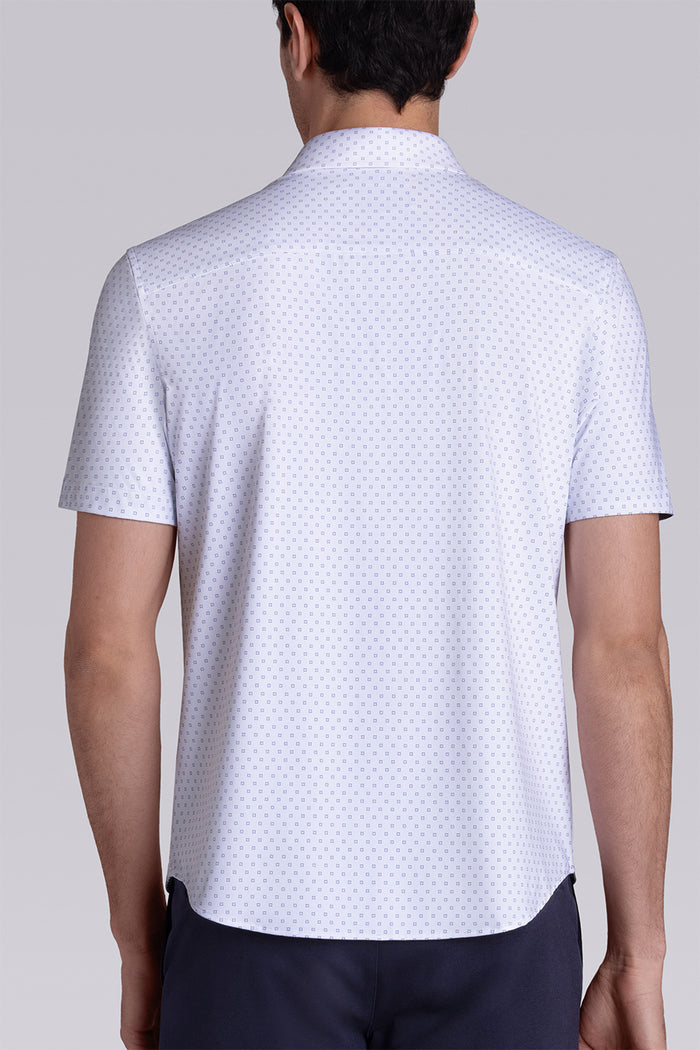 Model wearing Spirited White short sleeve classic collar shirt, styled with navy shorts