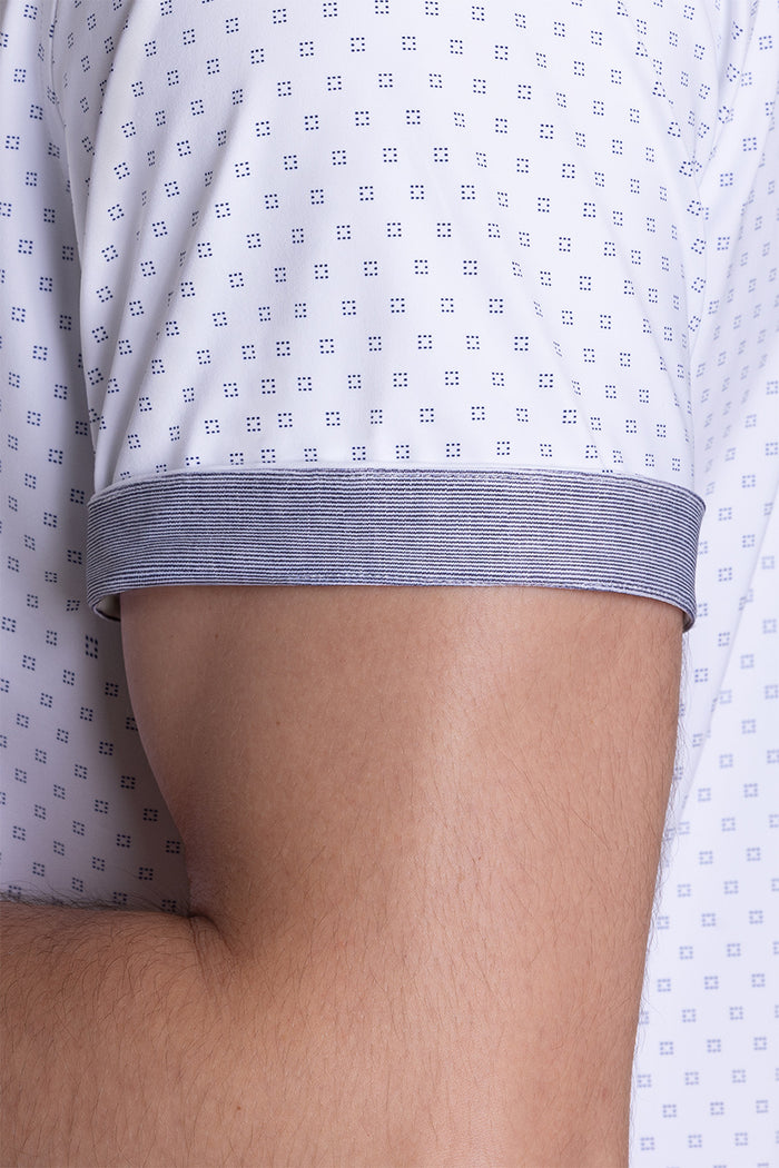Model wearing Spirited White short sleeve classic collar shirt, styled with navy shorts