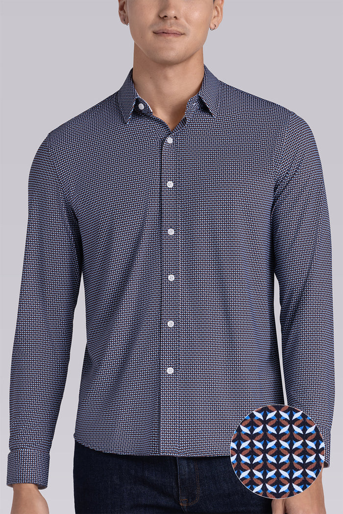Model wearing Spry Navy Taupe long sleeve shirt with built in classic collar with geometric print, styled with jeans pants.