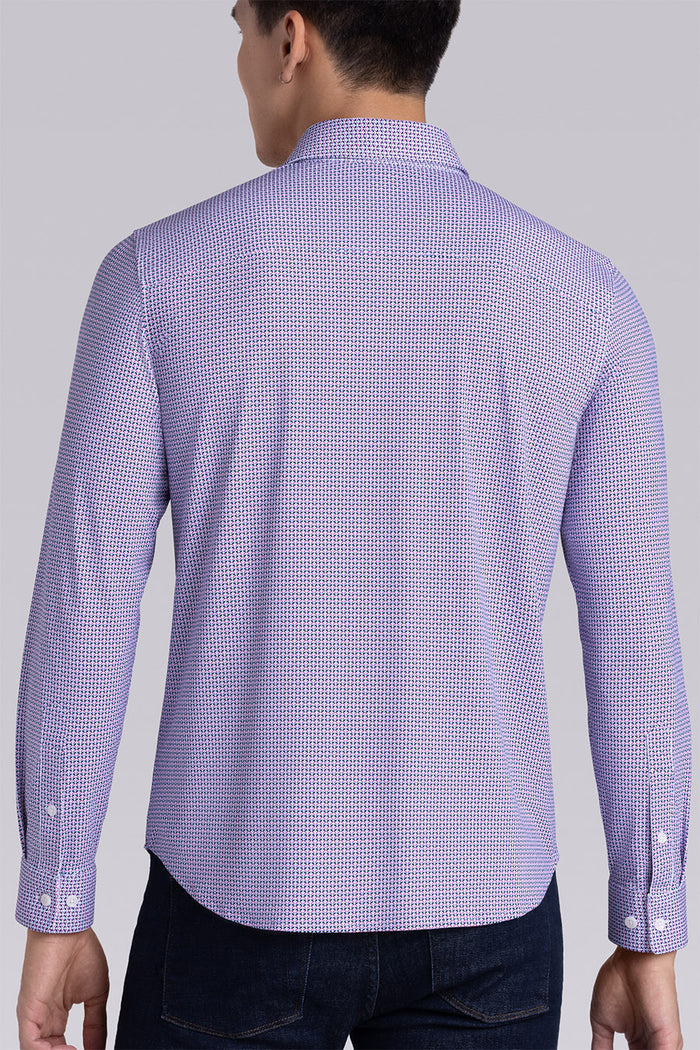 Model wearing Spry Pink long sleeve shirt with built in classic collar with geometric print, styled with jeans pants.