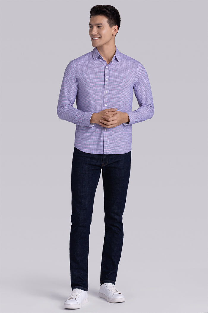 Model wearing Spry Pink long sleeve shirt with built in classic collar with geometric print, styled with jeans pants.