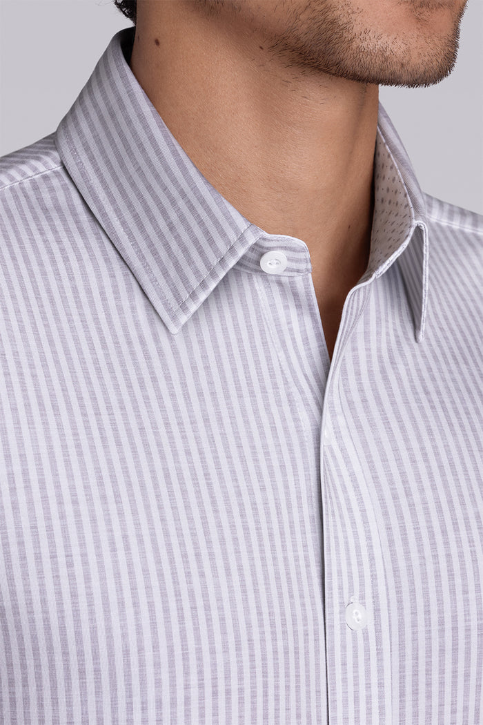 Model wearing Stamina Chateau Grey short sleeve classic collar, styled with white shorts
