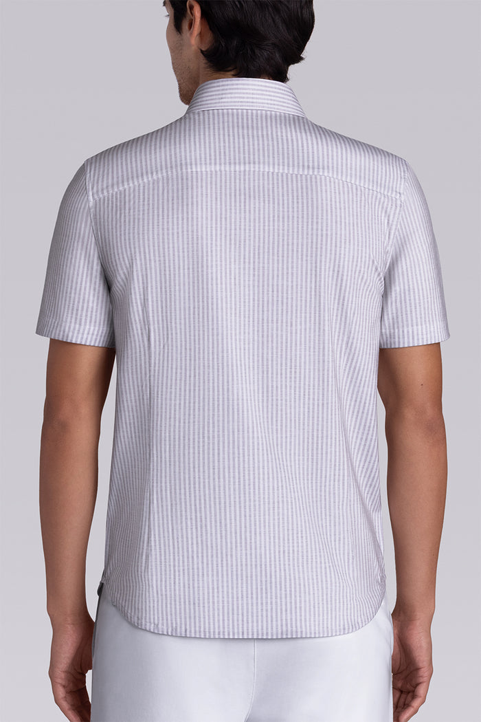 Model wearing Stamina Chateau Grey short sleeve classic collar, styled with white shorts