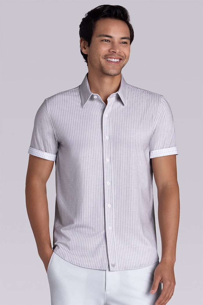 Model wearing Stamina Chateau Grey short sleeve classic collar, styled with white shorts