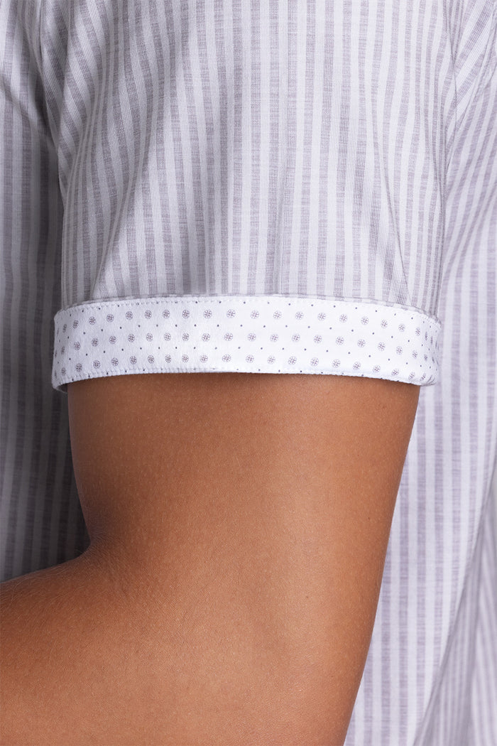 Model wearing Stamina Chateau Grey short sleeve classic collar, styled with white shorts
