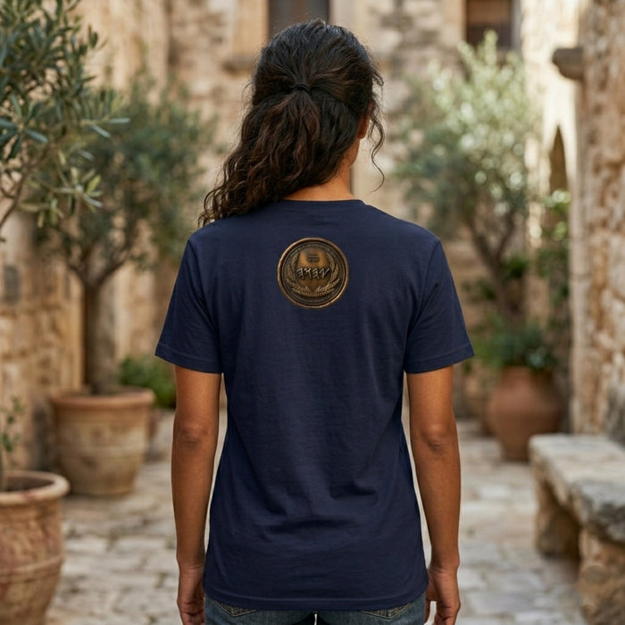 Back view of a navy blue oversized heavyweight t-shirt displaying a circular antiqued bronze medallion