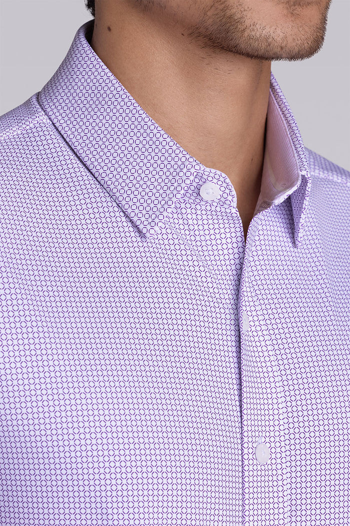 Model wearing Thrills Purple short sleeve classic collar, styled with navy shorts