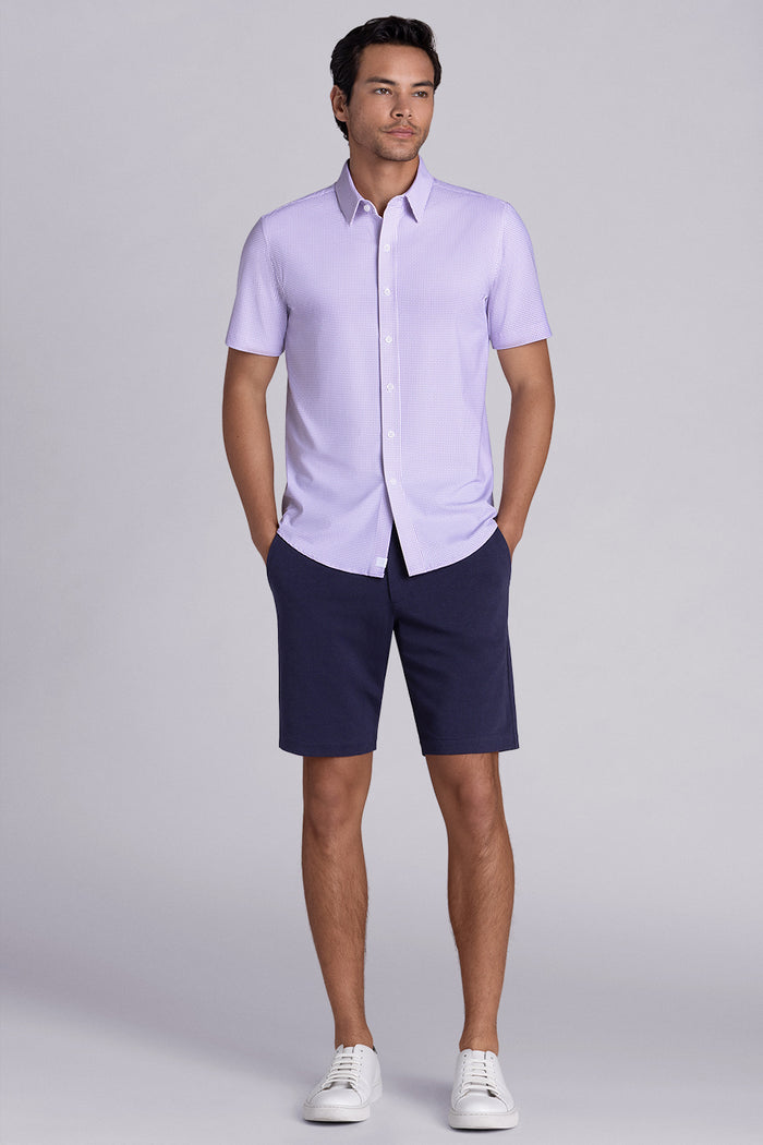 Model wearing Thrills Purple short sleeve classic collar, styled with navy shorts