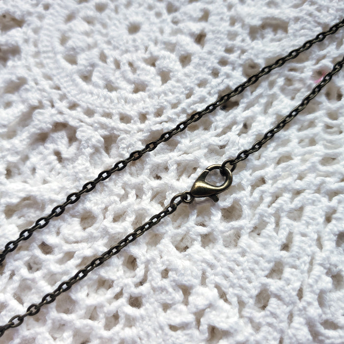 Tiny Embroidered Crow Necklace