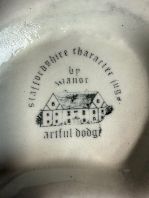 Two Staffordshire Character Jugs Dodger & Oliver