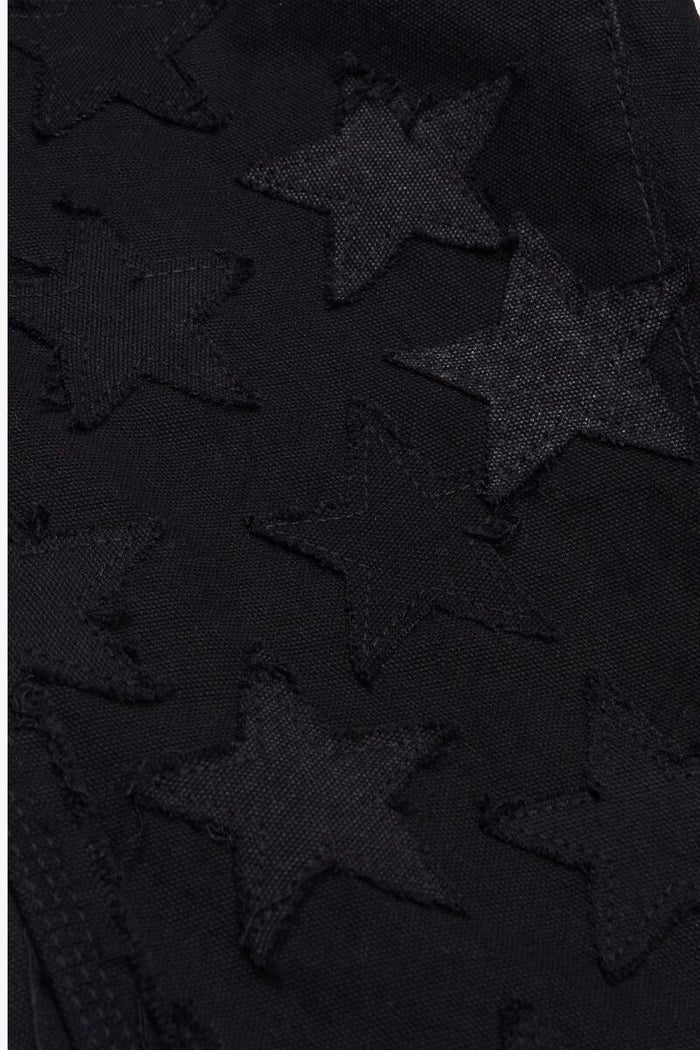 Model wearing Valabasas V-Stars Black Stacked Flare Denim Jeans with a stylish and trendy look