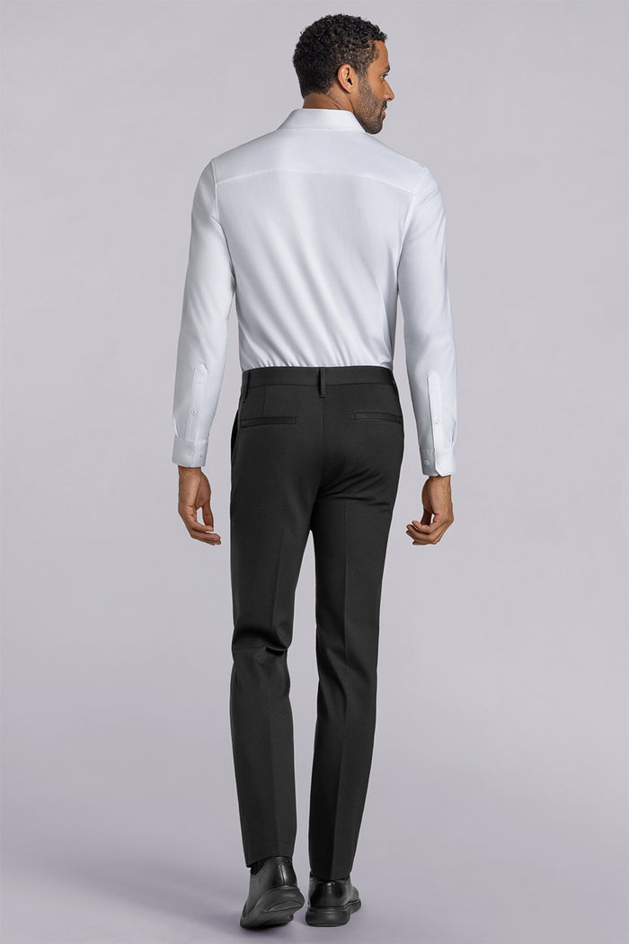 Model wearing Vigor Black Icy Knit mid rise pants, styled with white long sleeve shirt.